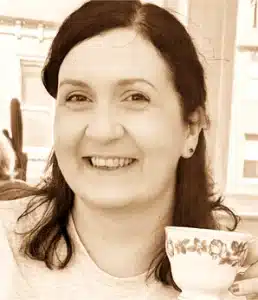 Lady smiling with tea cup